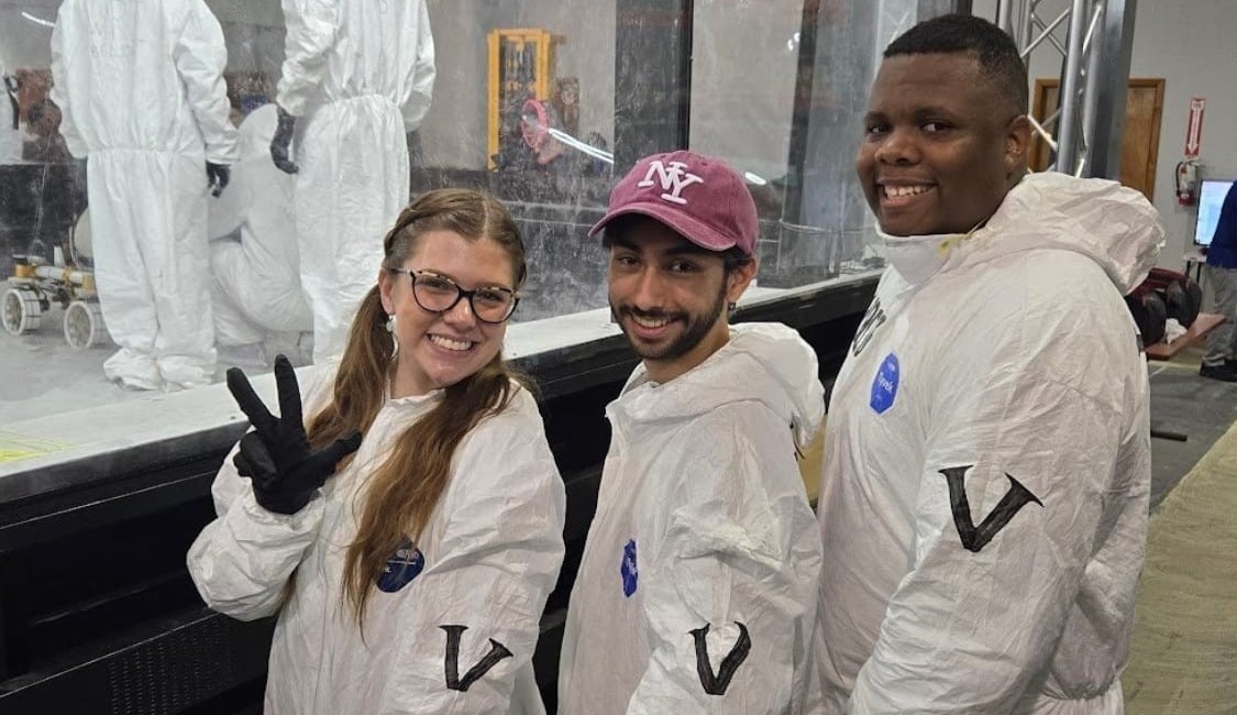 Vanderbilt Robotics electrical team standing next to the Lunabotics arena pit